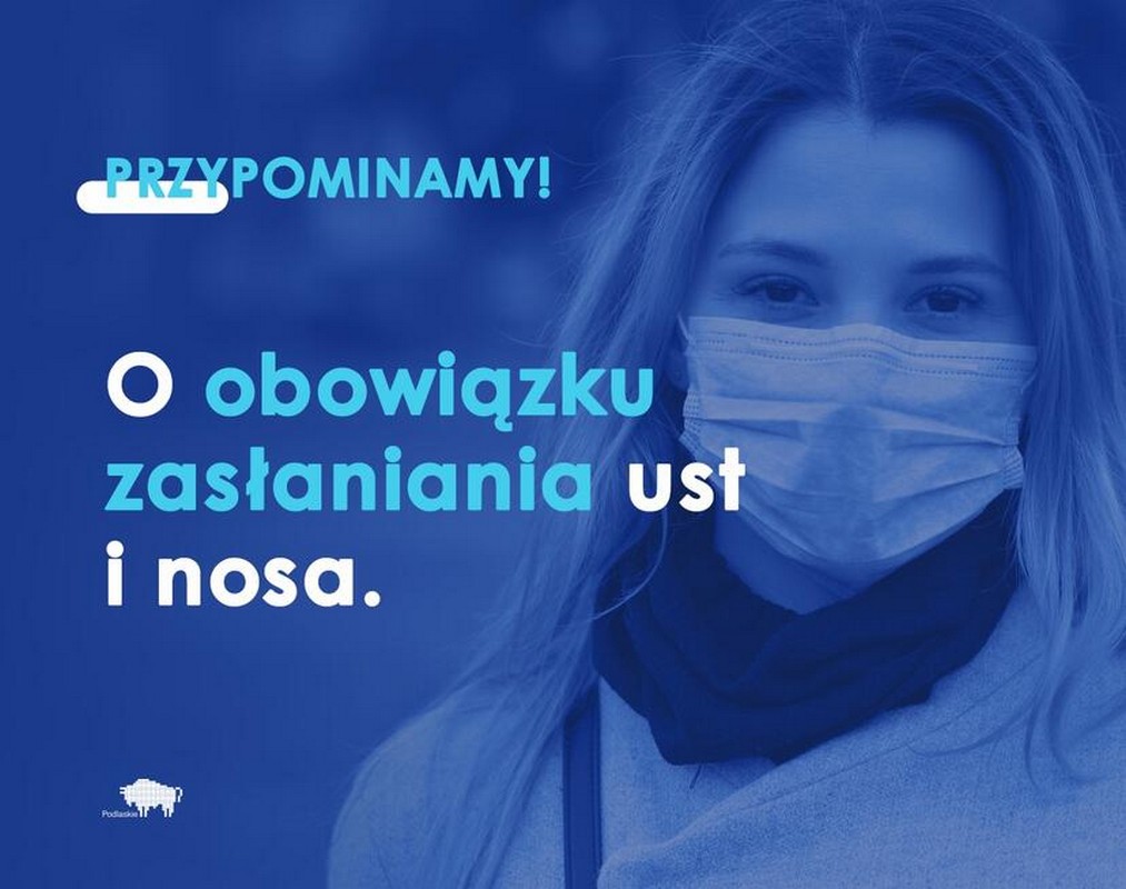 na zdjęciu widoczna długowłosa kobieta w maseczce medycznej oraz napis przypominamy o zakrywaniu nosa i ust